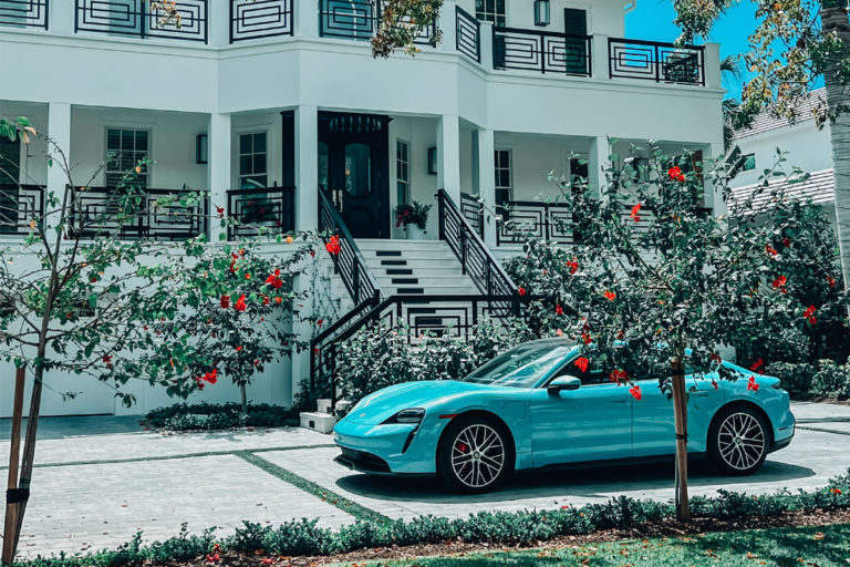 Image of a sportscar outside a home in Naples, Florida