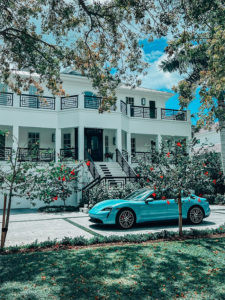 Image of a sports car outside a home in Naples, Florida
